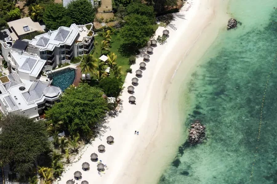 Aerial view of Le Cardinal Exclusive Resort's suites, pool and beach at Trou aux Biches, Mauritius