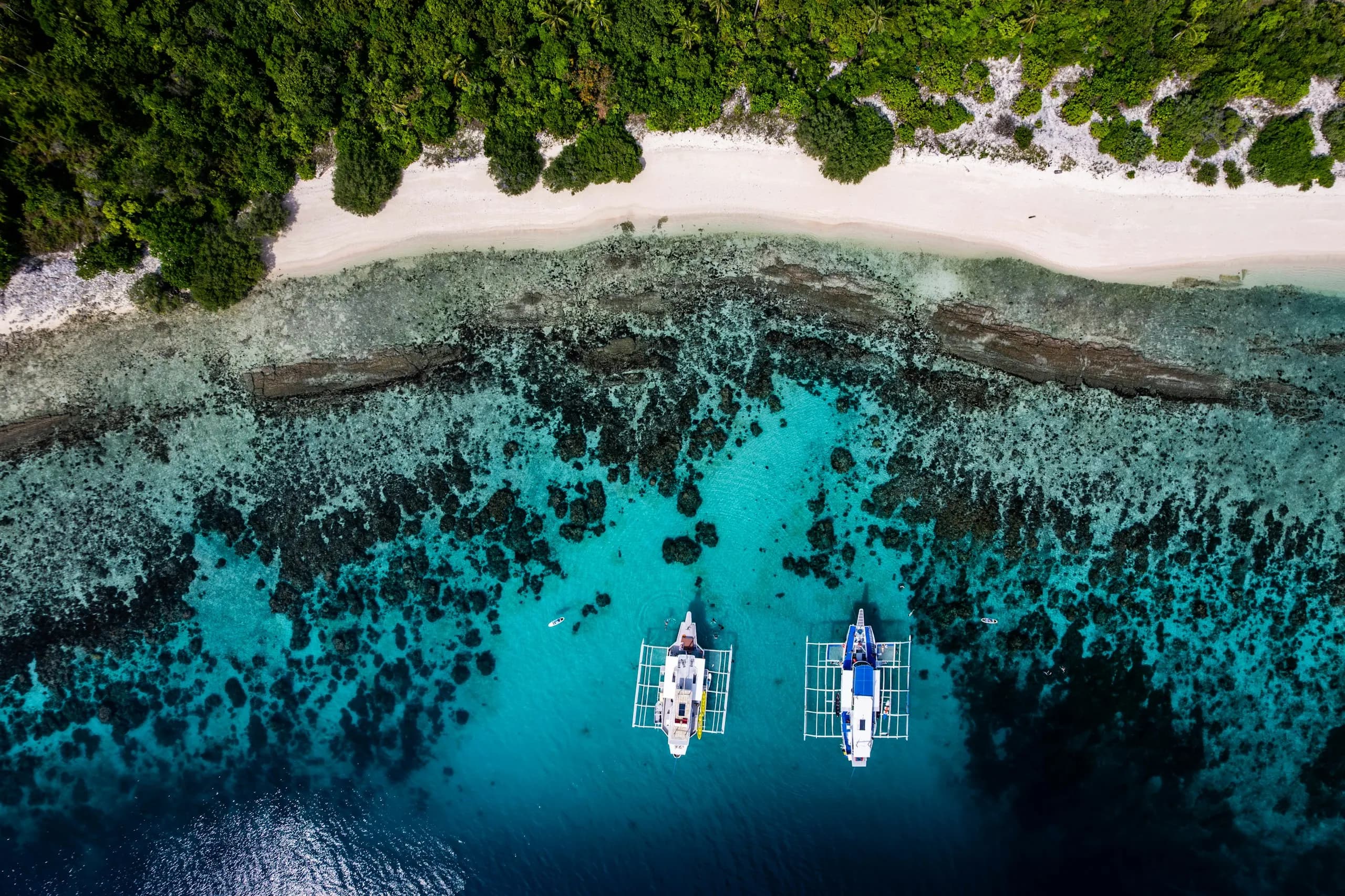Catamaran sailing on the turquoise east-coast lagoon of Mauritius