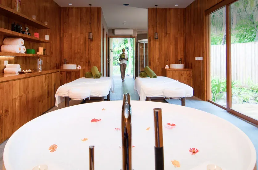 Treatment room and soaking tub at Javvu Spa, Amilla Maldives