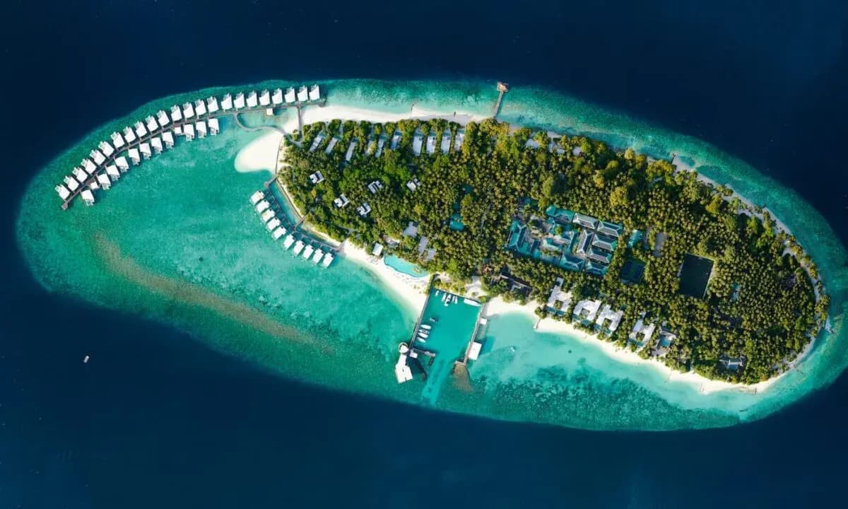 Aerial view of Amilla Maldives island, white sand beach and house reef