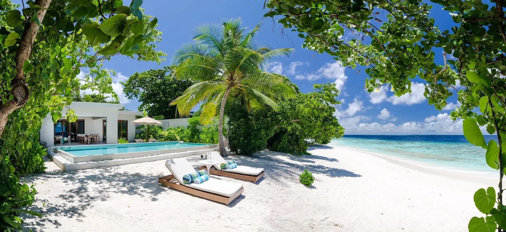 Two-Bedroom Beach Pool Villa pool and beachfront terrace at Amilla Maldives