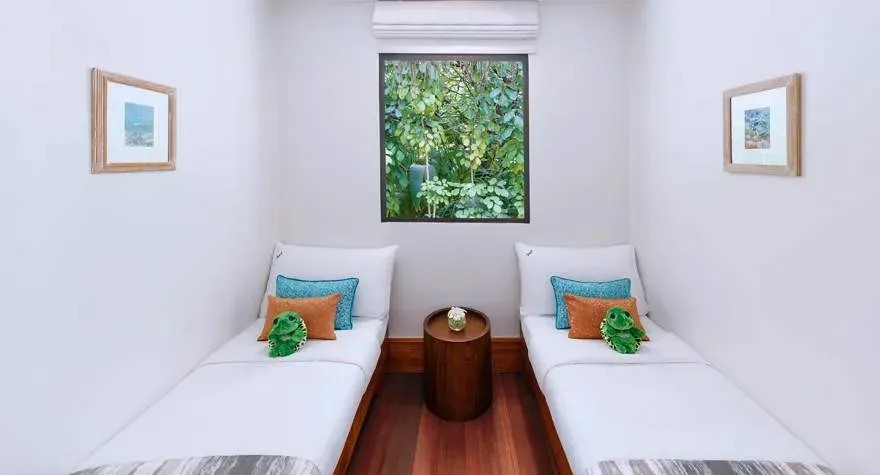 Kids' sleeping quarter in a One Bedroom Family Beach Pool Villa at Anantara Kihavah Maldives Villas