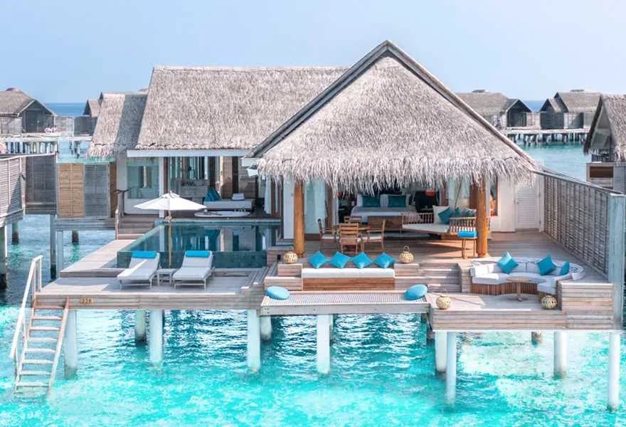 Aerial view of an Over Water Pool Villa on the lagoon at Anantara Kihavah Maldives Villas