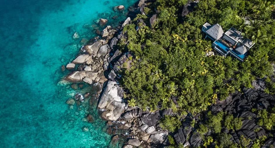 Aerial view of Anantara Maia Seychelles Villas' hillside villas set among thirty acres of forest, Mahe