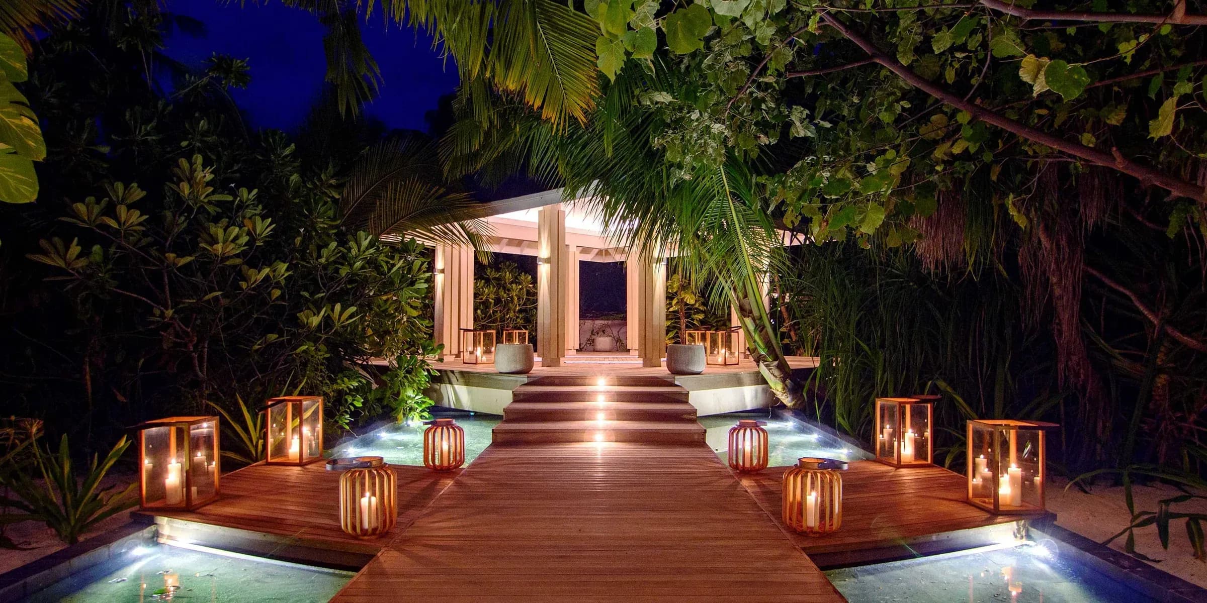 Aura Spa treatment pavilion at night, Baglioni Resort Maldives