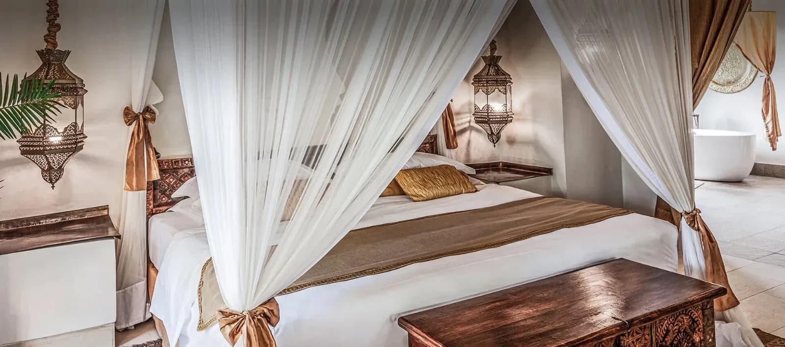 Four-poster bed and Swahili-Arabic decor in the One Bedroom Villa at Baraza Resort & Spa Zanzibar