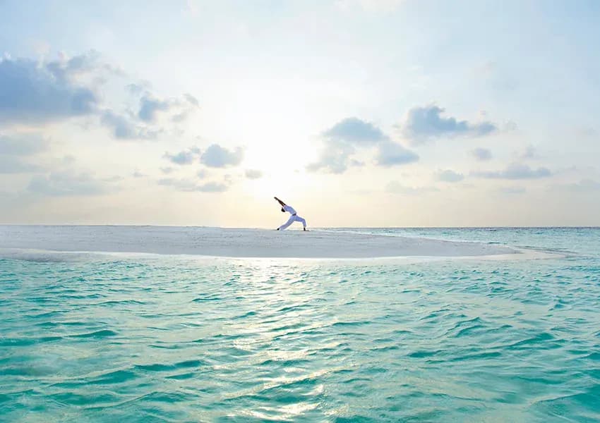 Yoga session overlooking the ocean at Baros Maldives