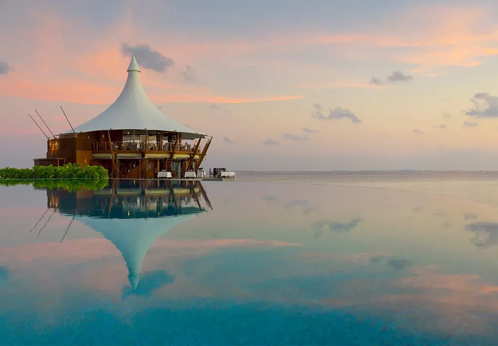 Lagoon-side dining deck at Lime Restaurant, Baros Maldives