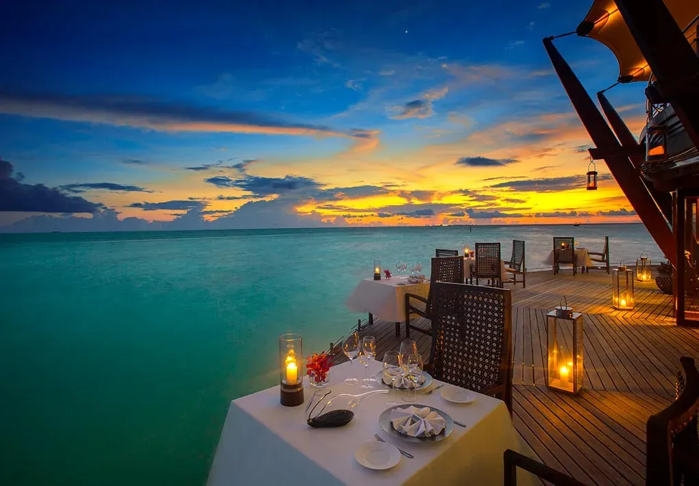 Sunset table setting at The Lighthouse overwater restaurant, Baros Maldives