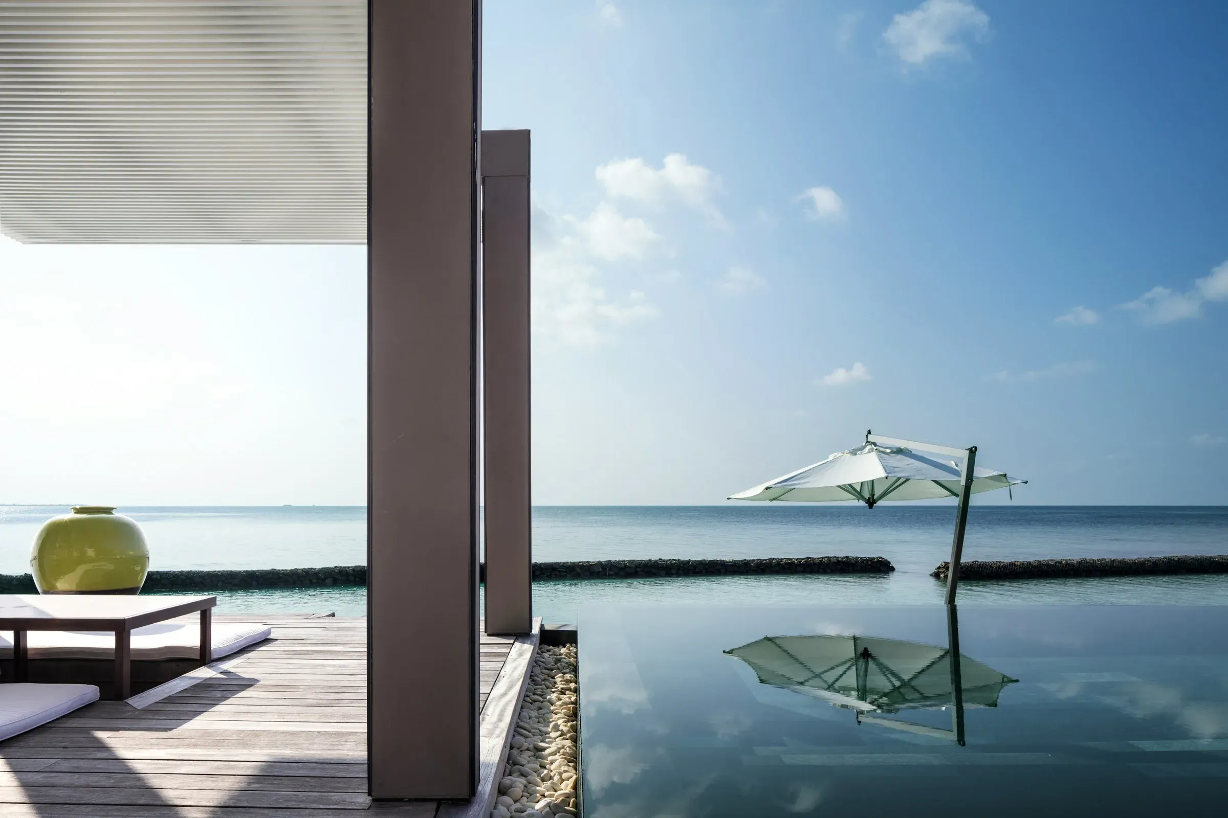 Interior of the 1-Bedroom Water Villa at sunrise, Cheval Blanc Randheli