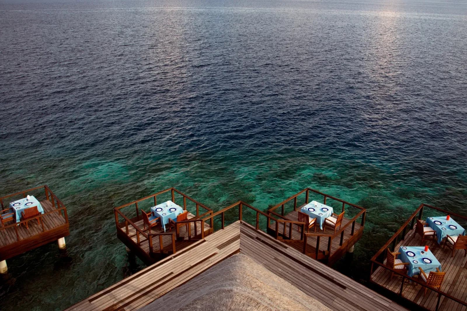 Aqua overwater fine-dining restaurant deck at Coco Bodu Hithi