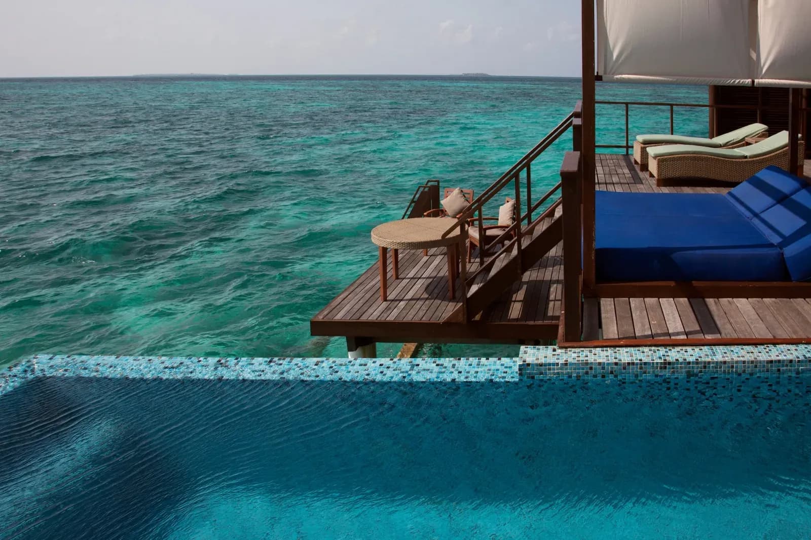 Coco Residence overwater villa with private pool at Coco Bodu Hithi