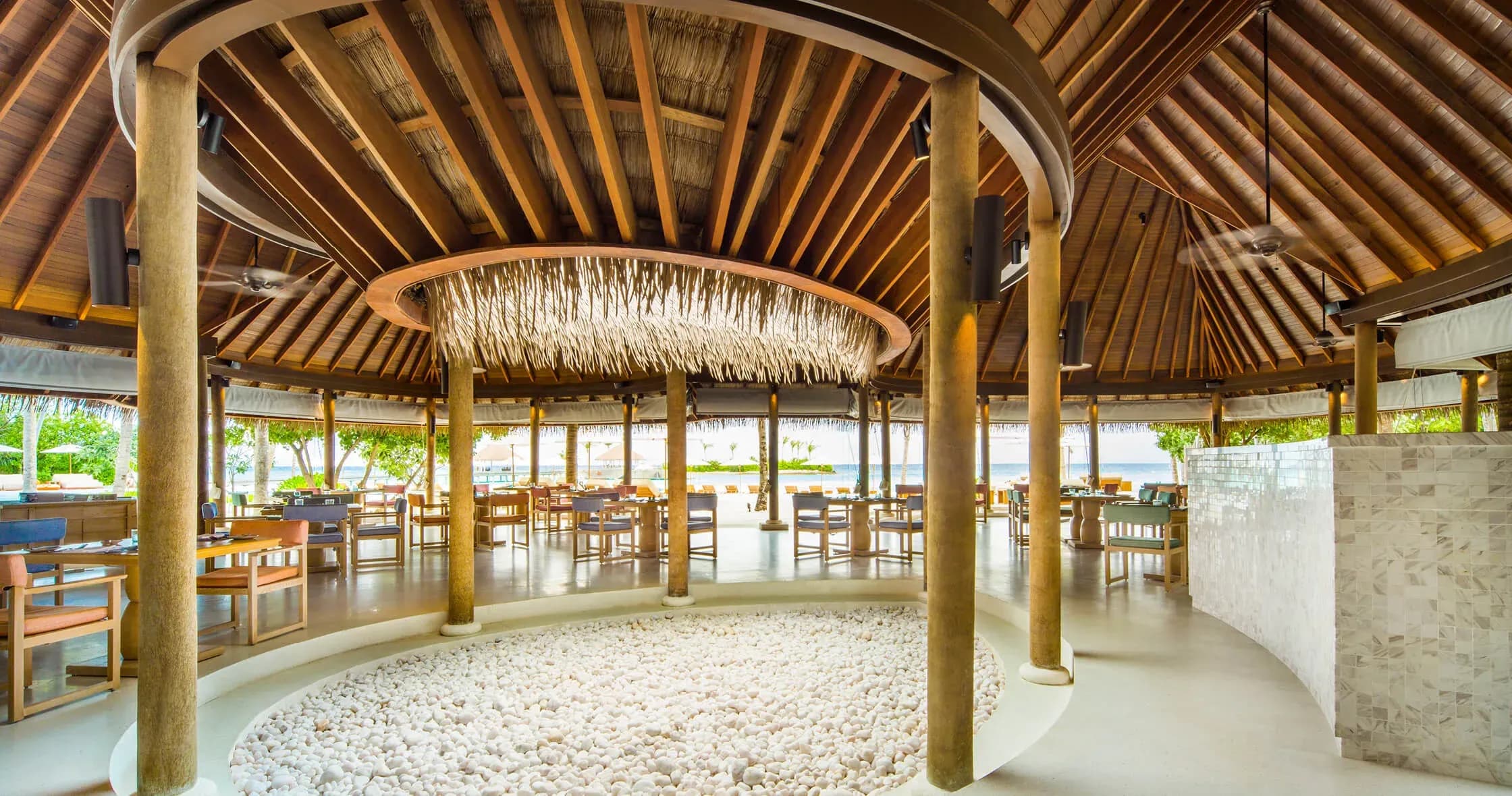 MADI restaurant open-air dining pavilion overlooking the beach at COMO Maalifushi