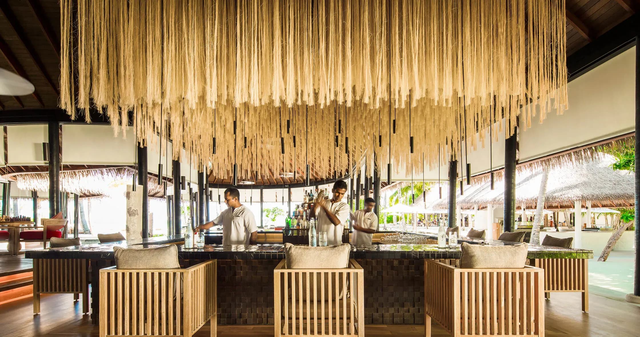 Thila open-air bar overwater deck at COMO Maalifushi