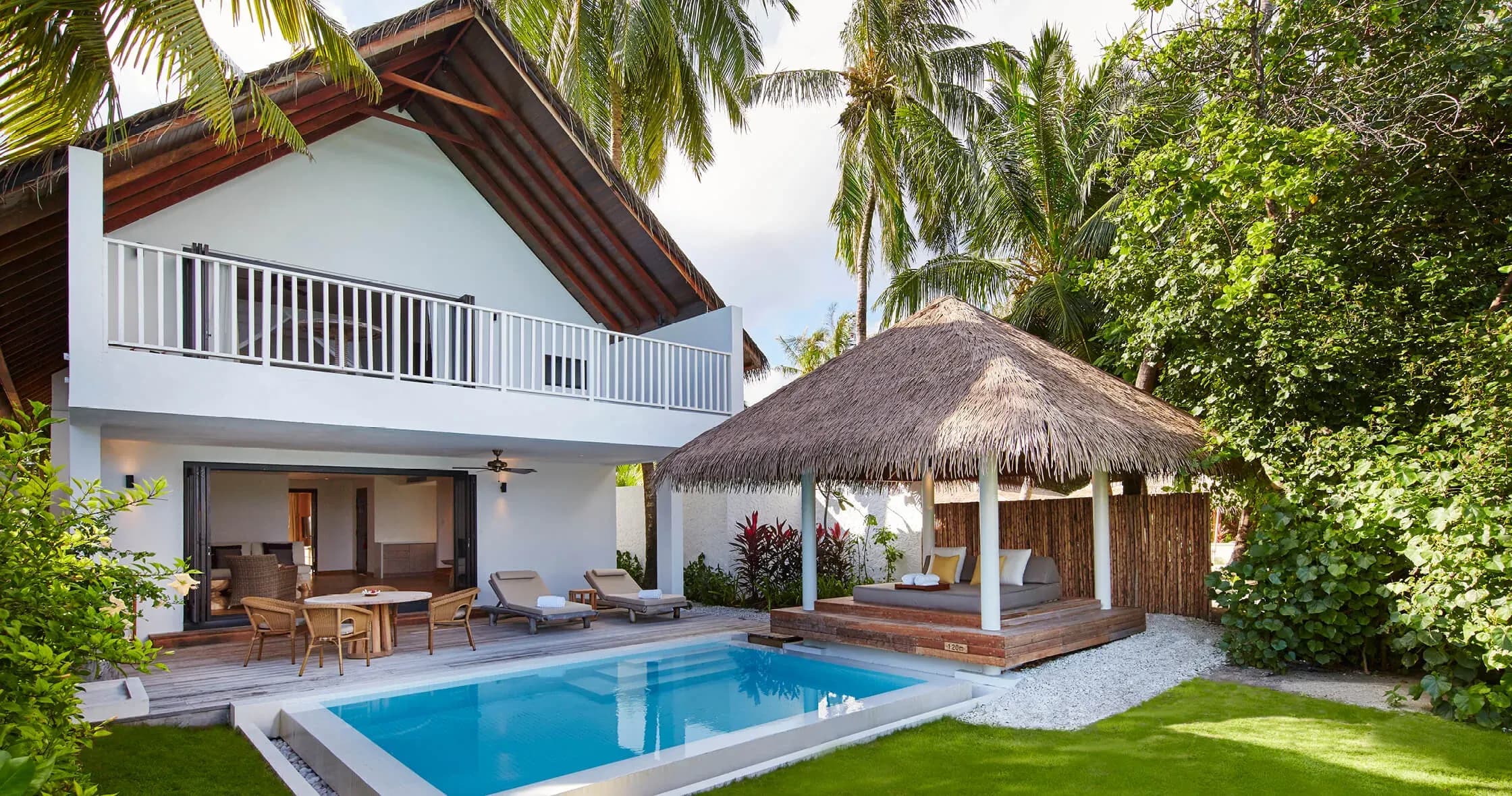 Two-Bedroom Beach House exterior with private pool and thatched cabana at COMO Maalifushi