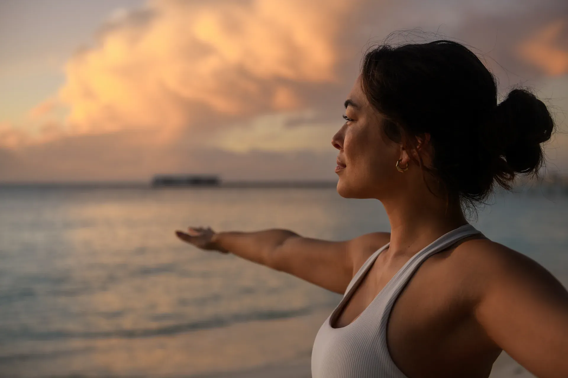 Outdoor beach yoga session at Conrad Maldives Rangali Island