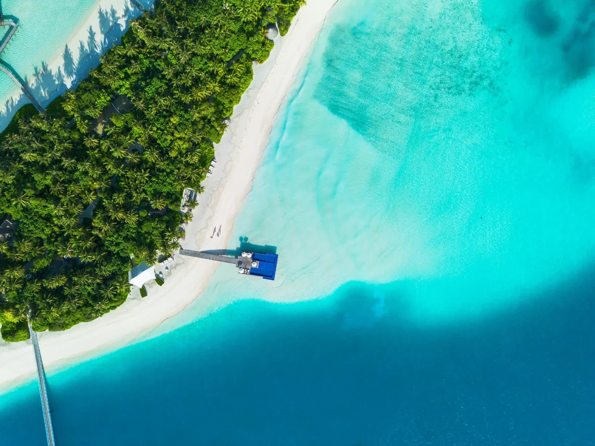 Aerial view of the lagoon, reef and pool at Conrad Maldives Rangali Island