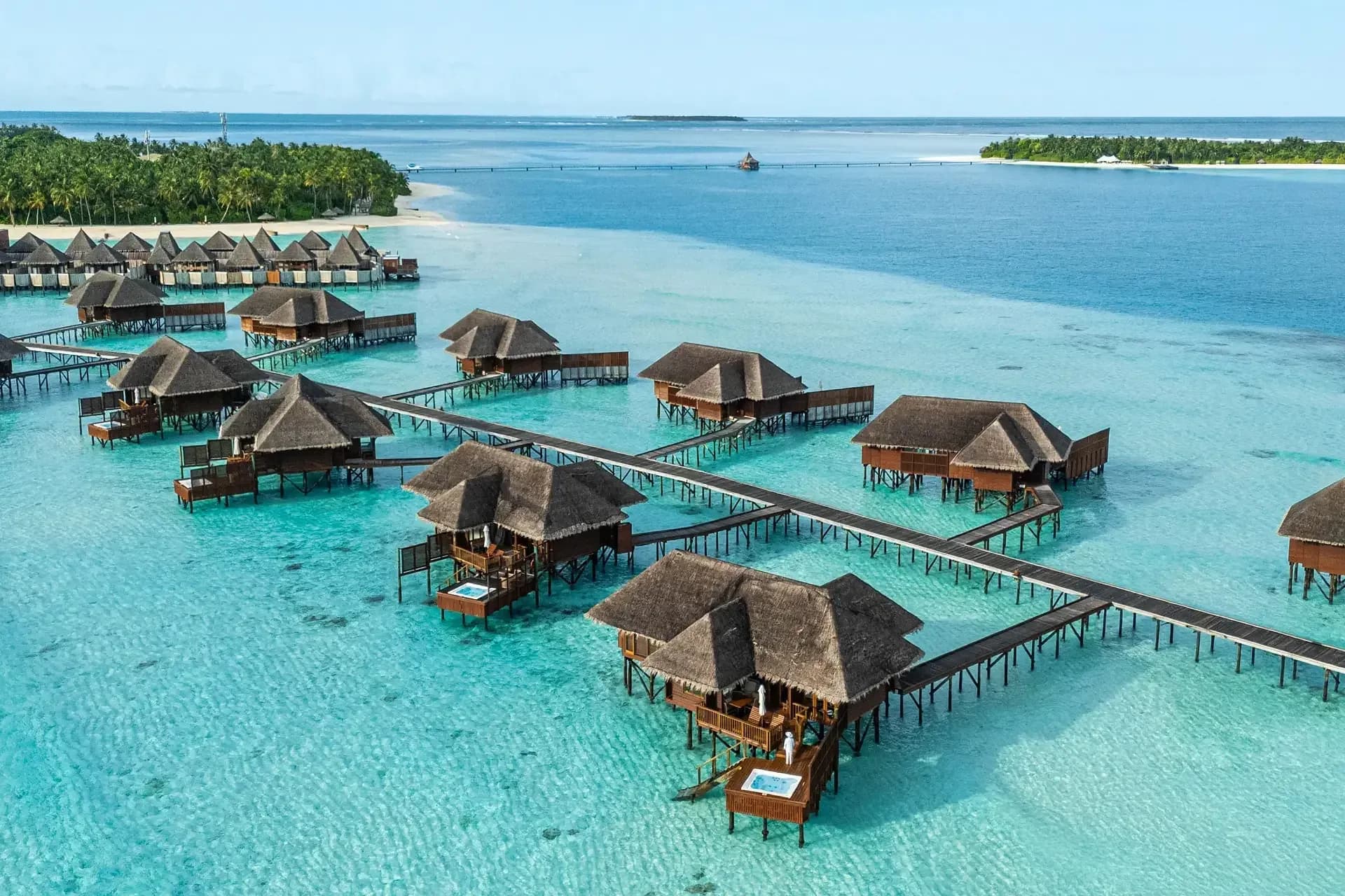 Aerial view of the Grand Water Villa over the lagoon at Conrad Maldives Rangali Island