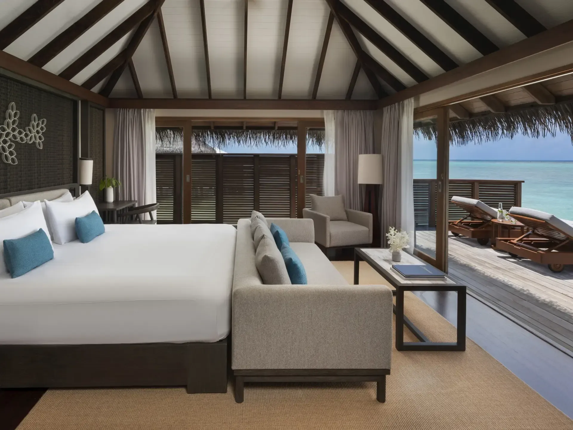 Bedroom of the Sunset Water Villa with Pool at Conrad Maldives Rangali Island