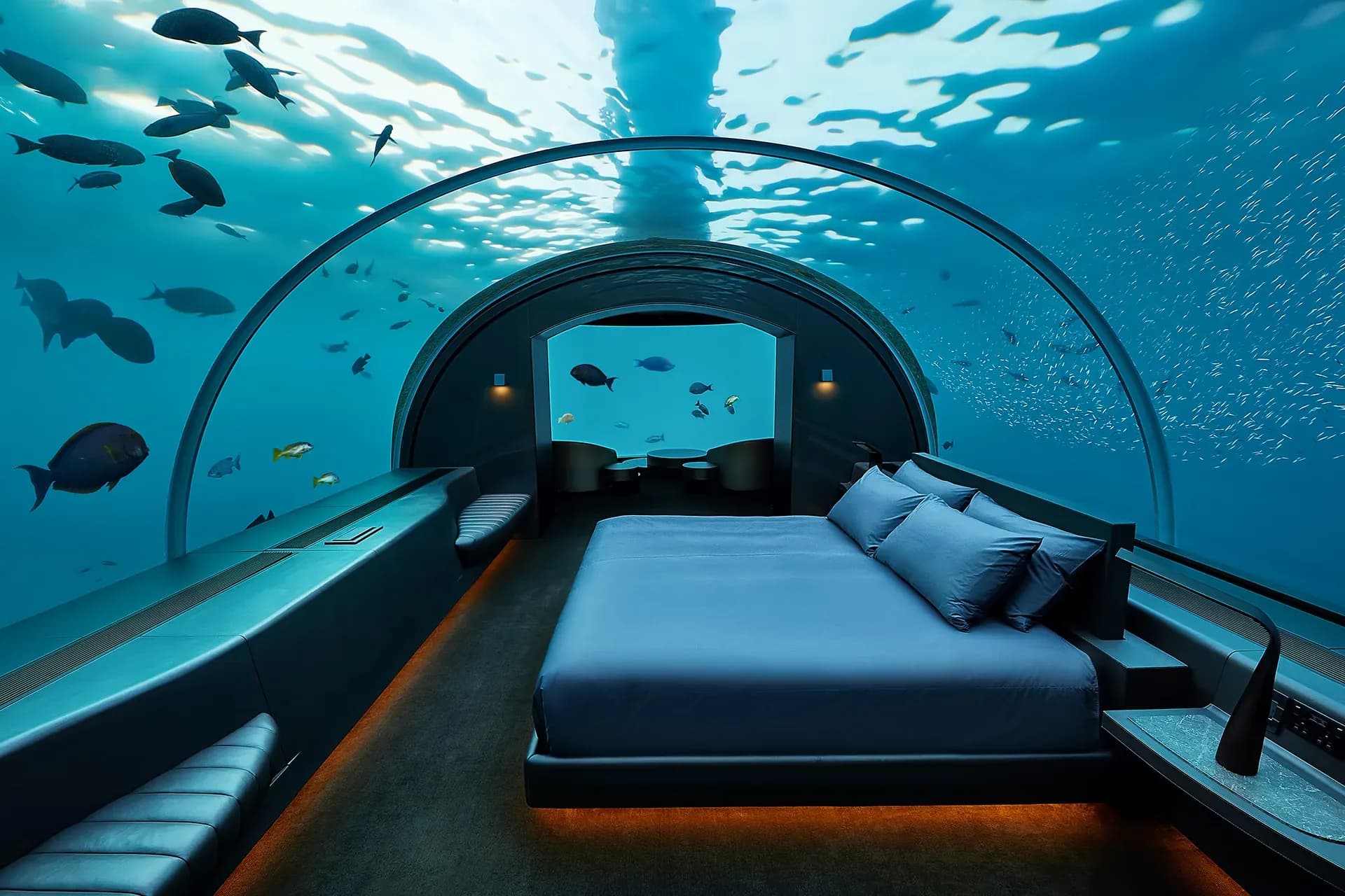 Underwater master bedroom of The Muraka, with a 180-degree acrylic dome and reef fish, Conrad Maldives Rangali Island