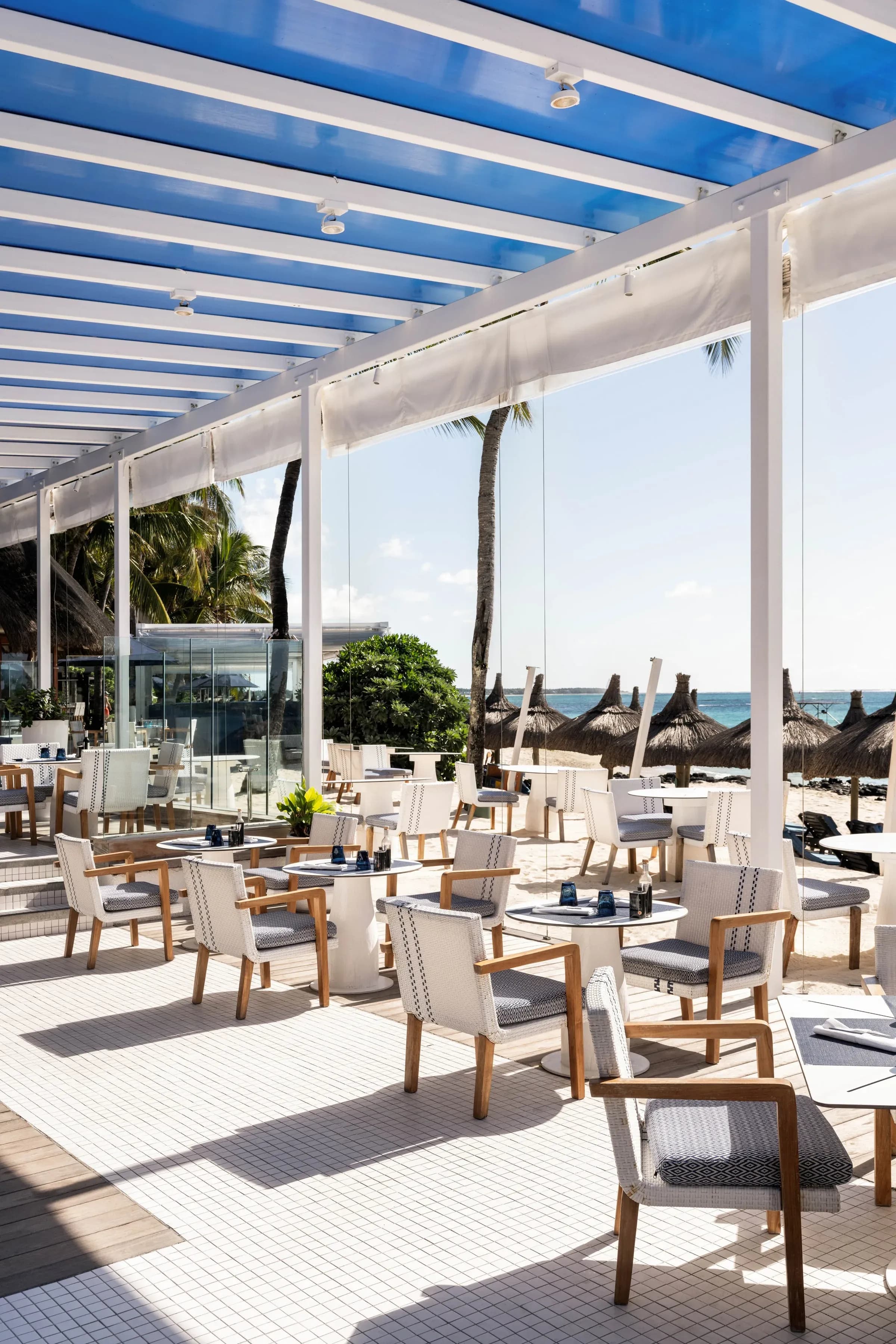 Indigo restaurant deck over the pool and sea at Constance Belle Mare Plage