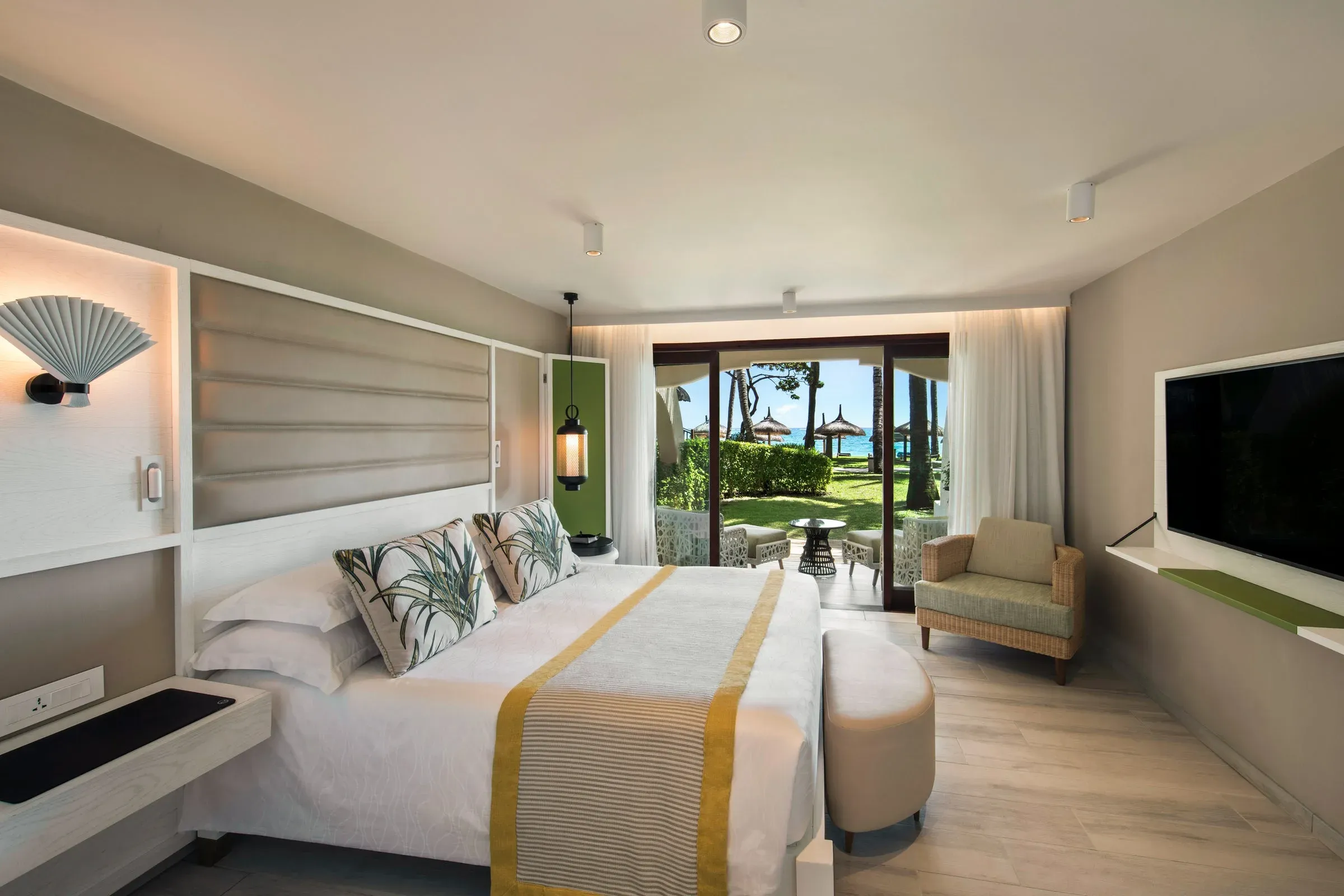 Deluxe Suite living room with ocean-view balcony at Constance Belle Mare Plage