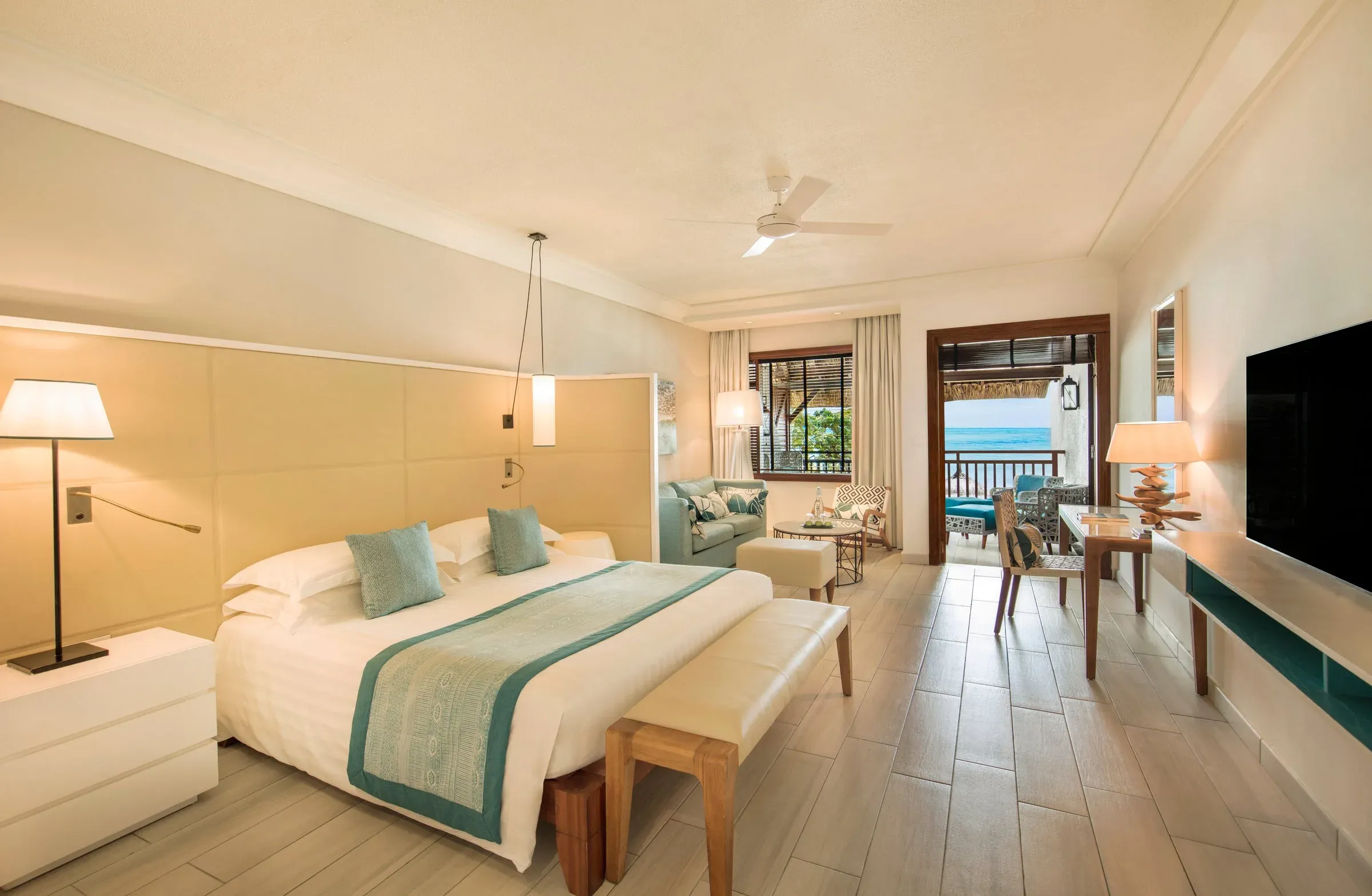 Junior Suite interior with wood and marble decor at Constance Belle Mare Plage