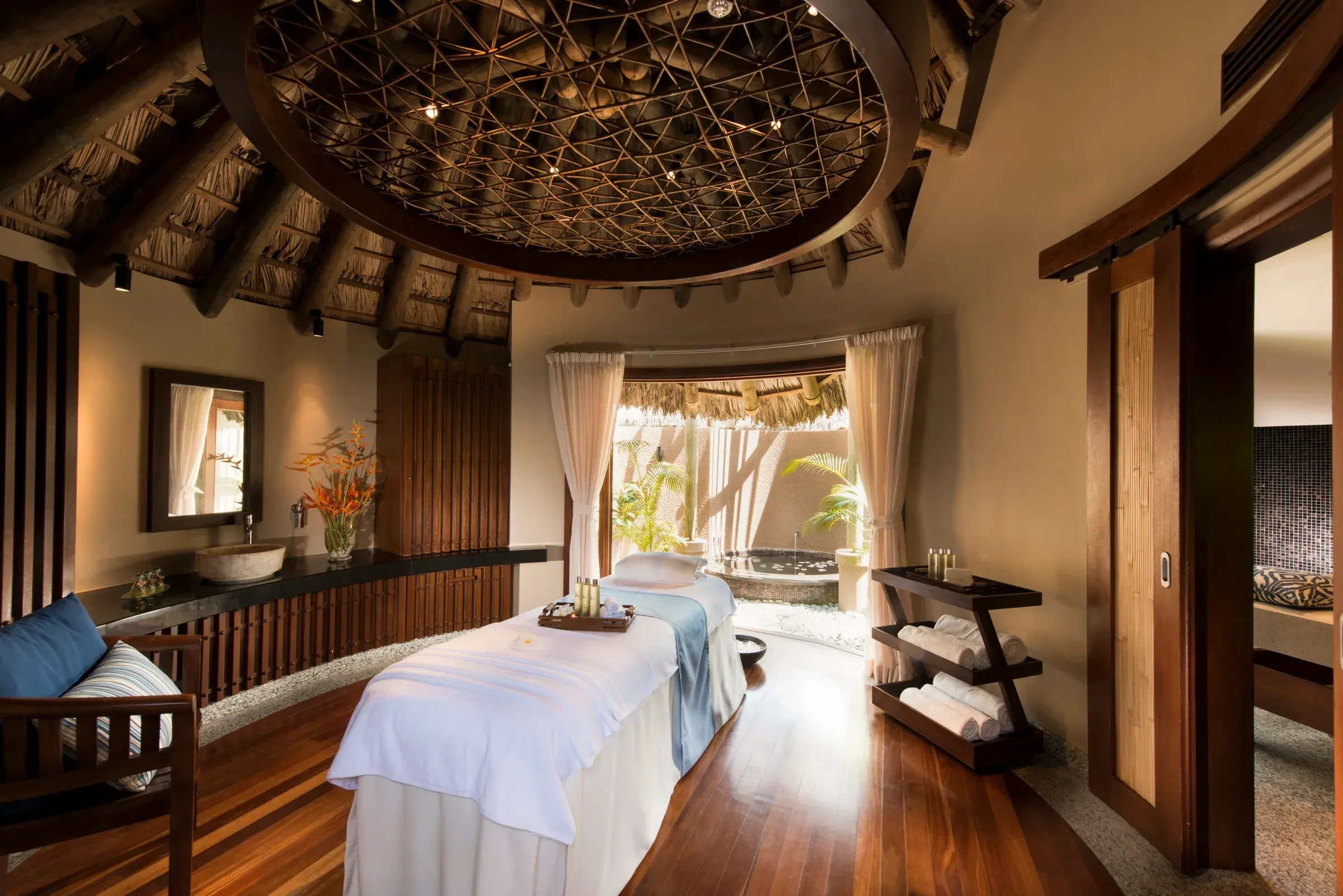 Constance Spa treatment pavilion set in tropical gardens at Constance Ephelia