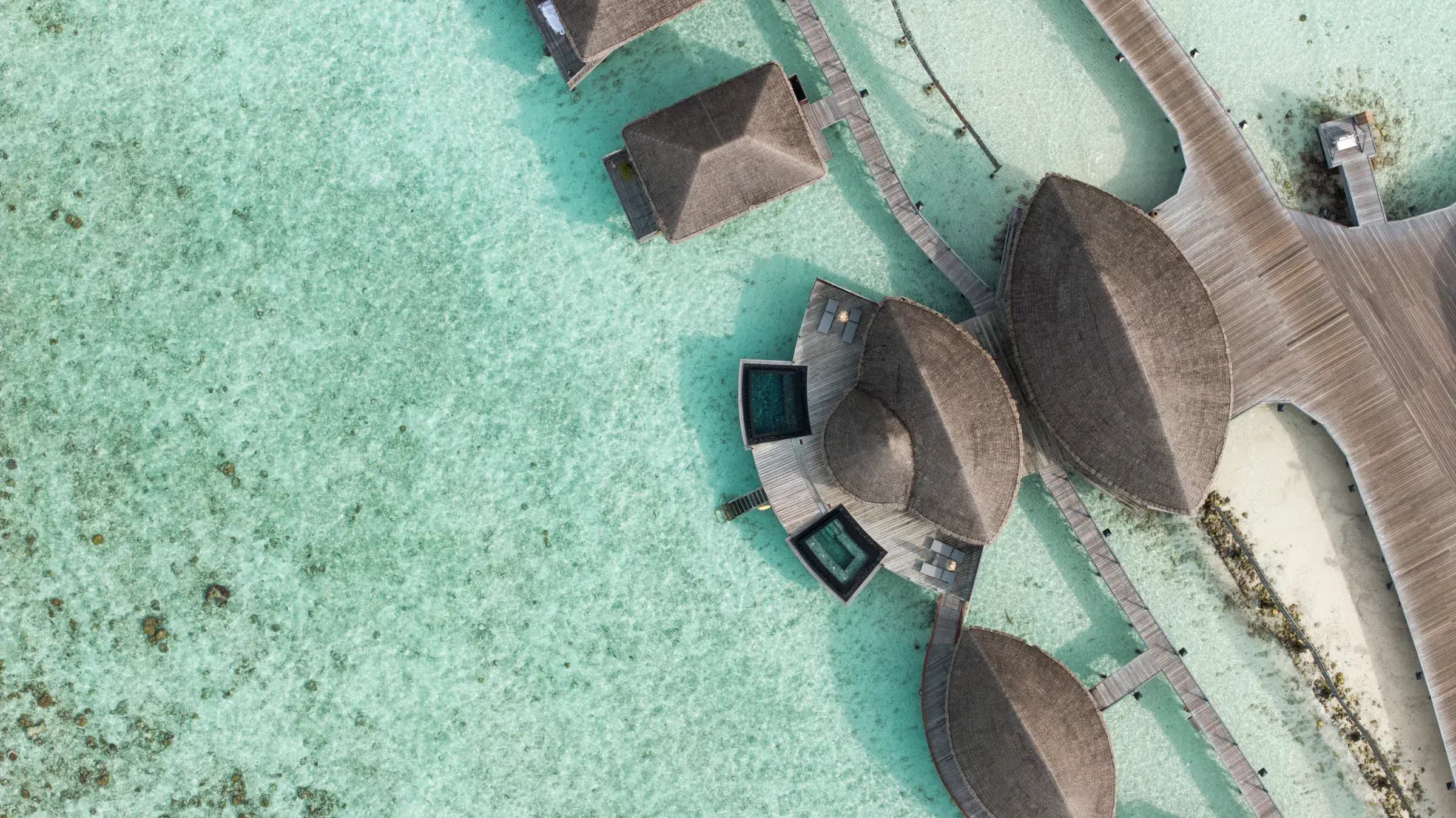 Constance Spa treatment pavilion over the lagoon at Constance Halaveli