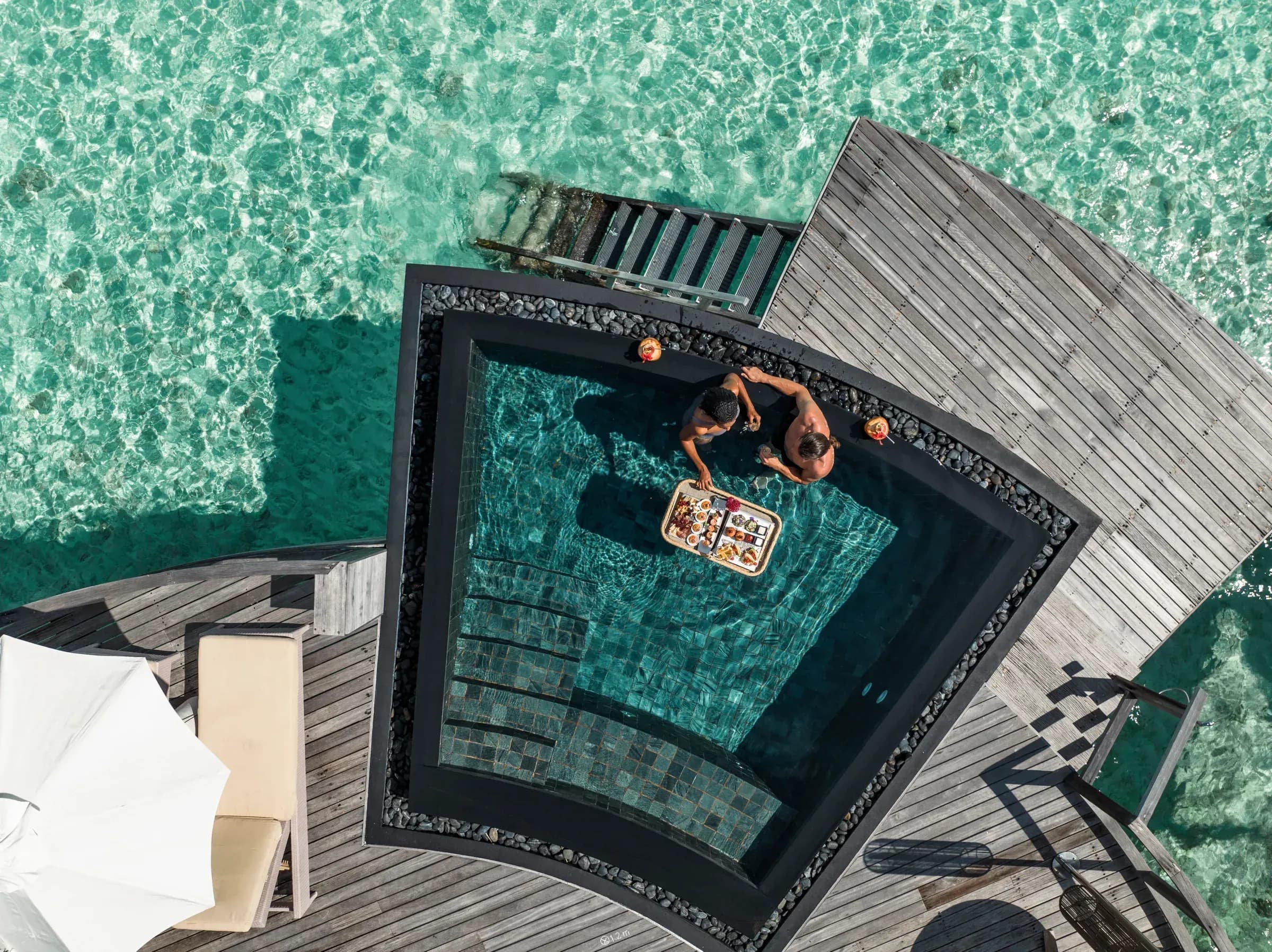 Private plunge pool over the lagoon at a Constance Halaveli Water Villa