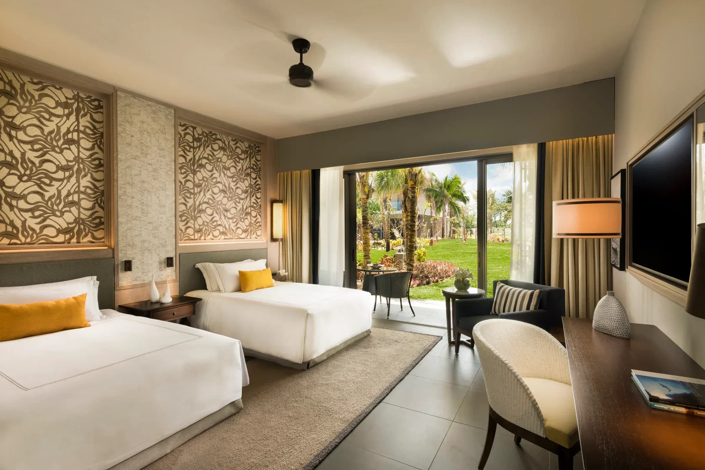 Deluxe Garden Room living and sleeping area at Constance Le Chaland