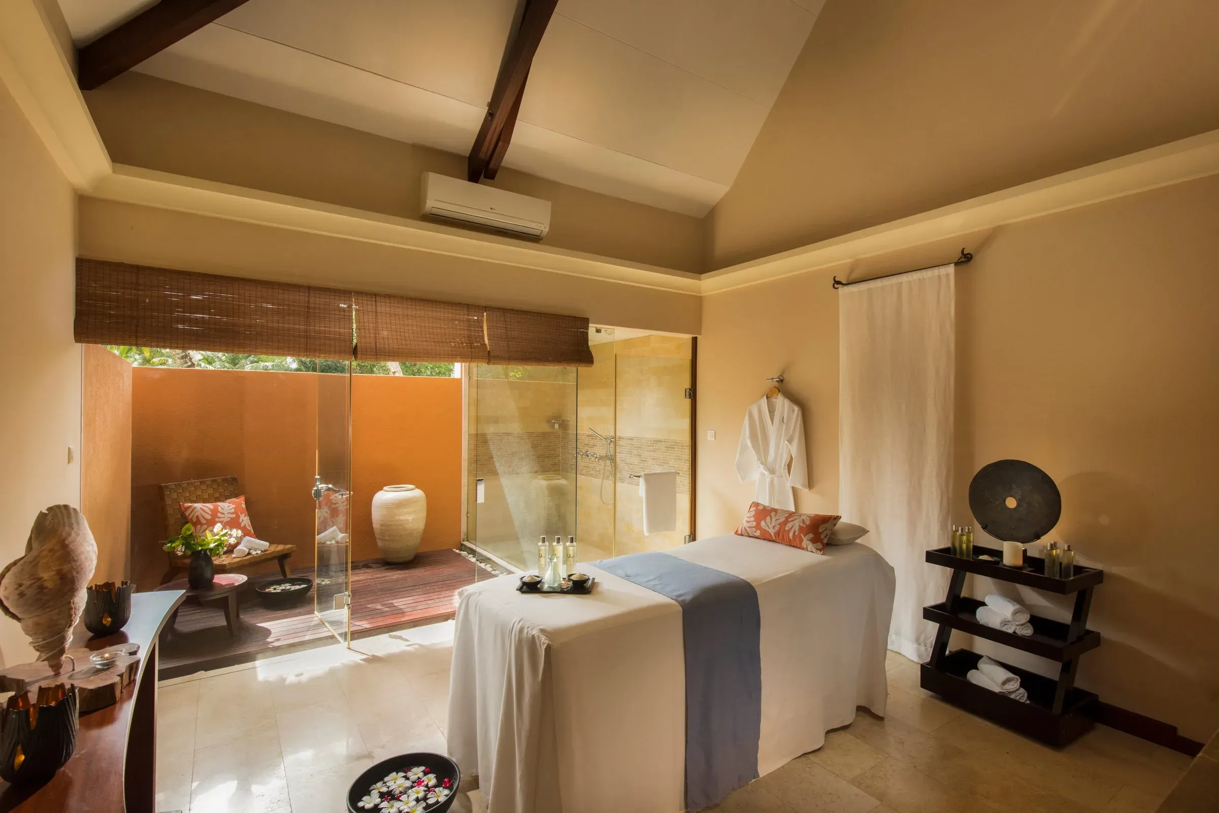 Constance Spa treatment pavilion set among palm trees at Constance Lemuria