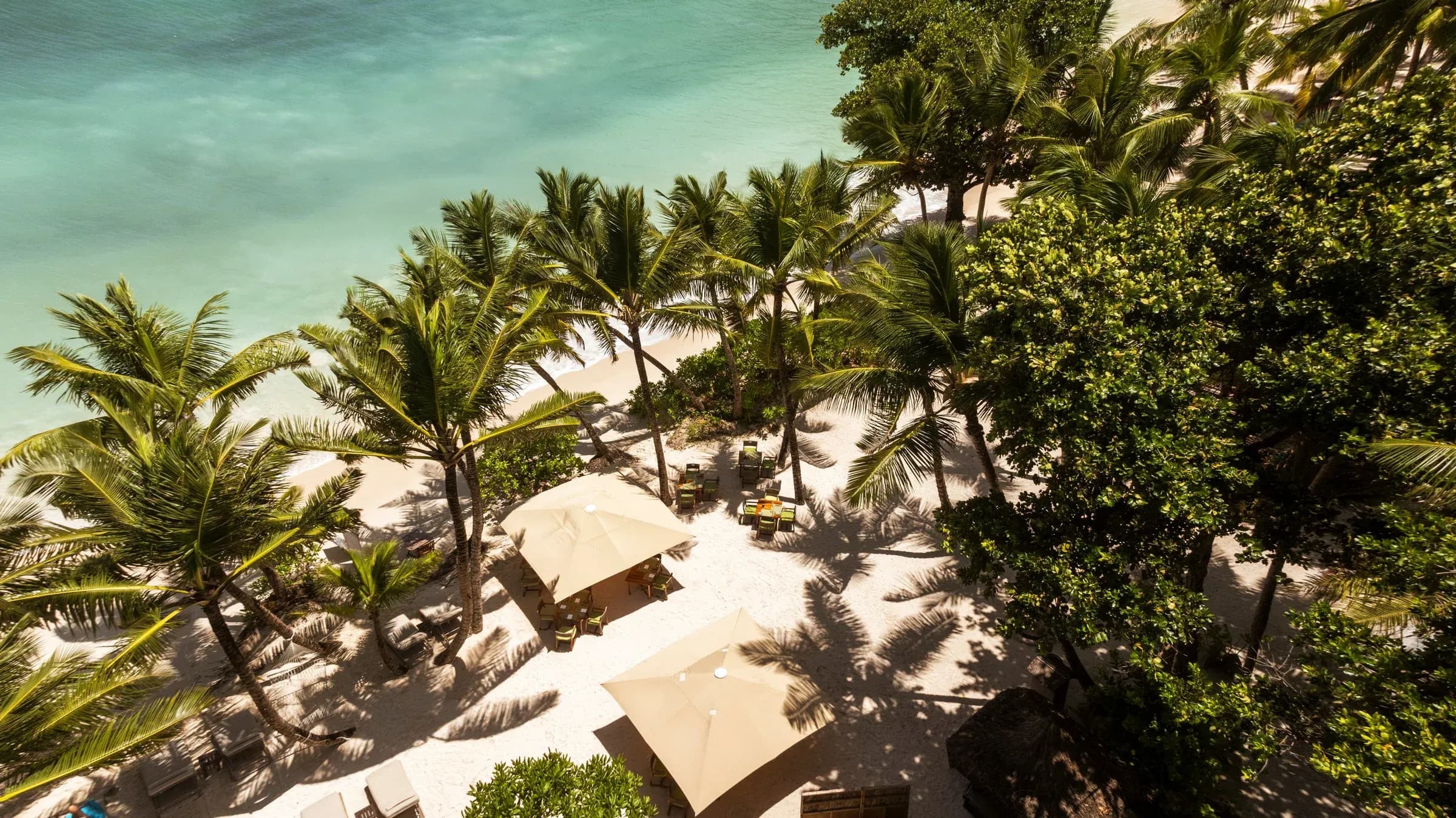 Takamaka barefoot dining deck steps from Petite Anse Kerlan beach