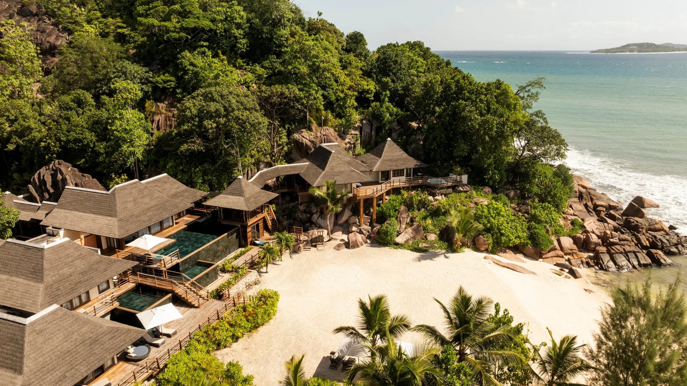 Aerial view of the Presidential Villa's multi-level pools and private beach at Constance Lemuria