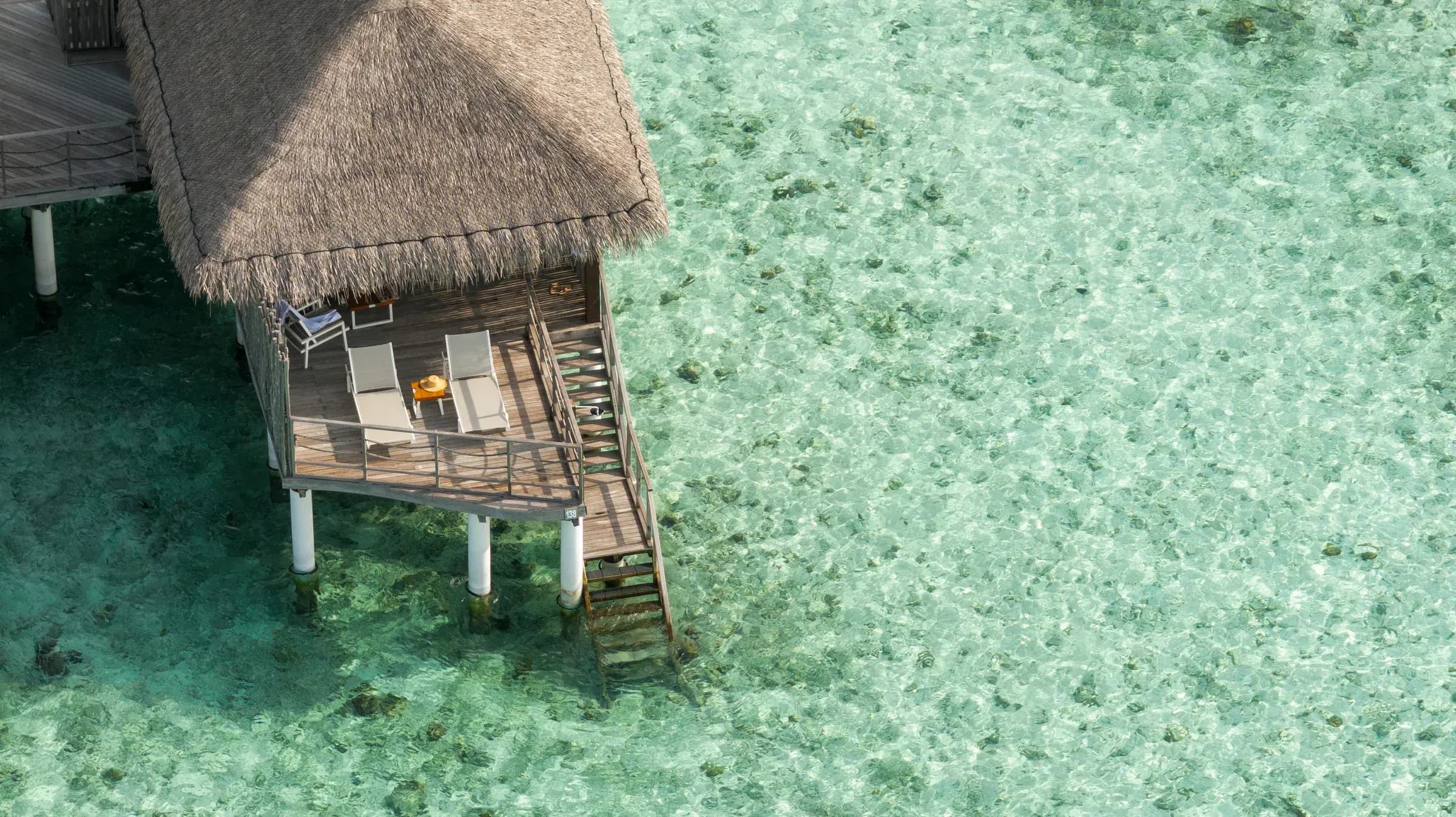 Water Villa exterior over the lagoon at Constance Moofushi