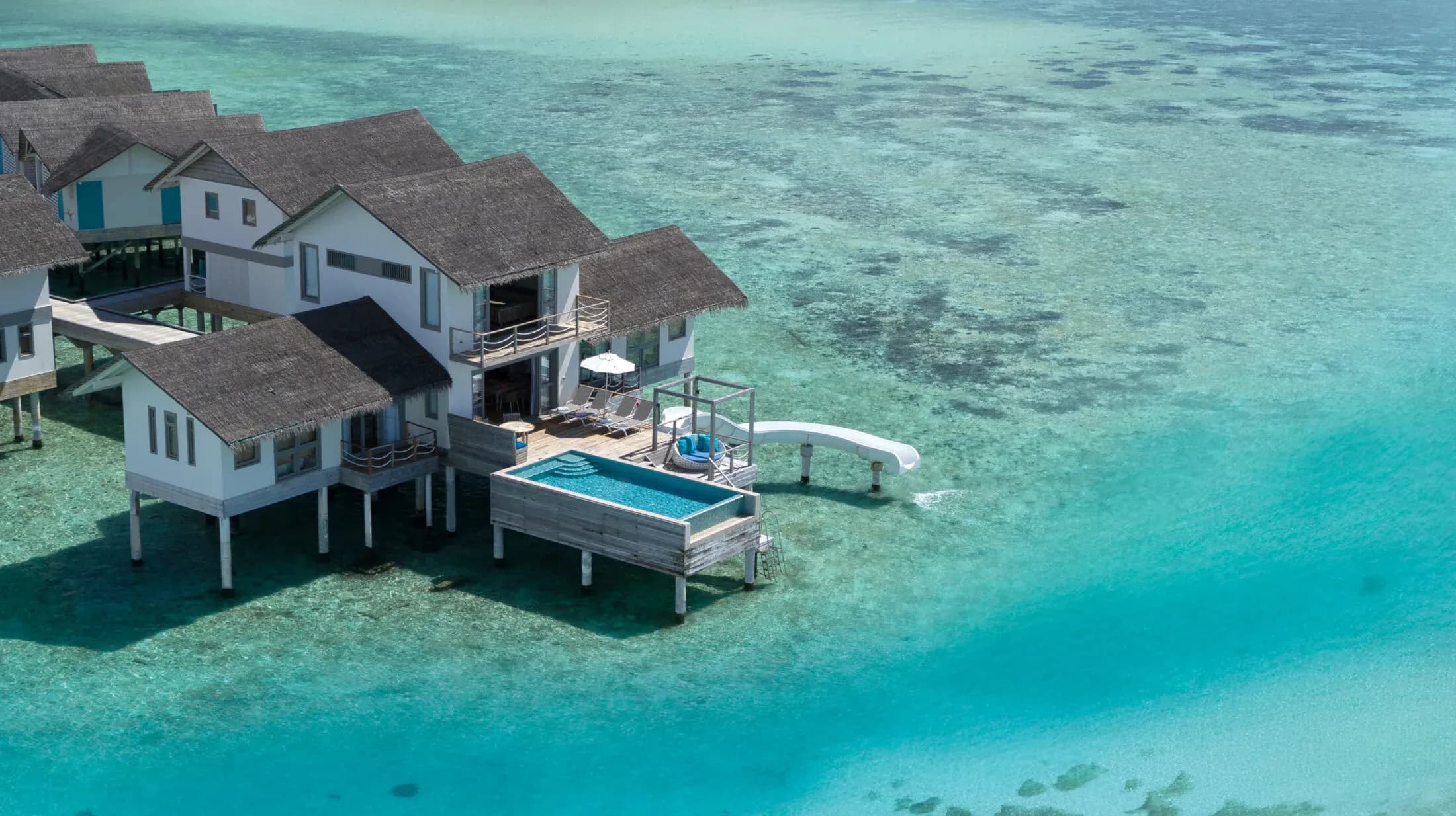 Two Bedroom Lagoon Pool Villa with Slide, aerial view at Cora Cora Maldives
