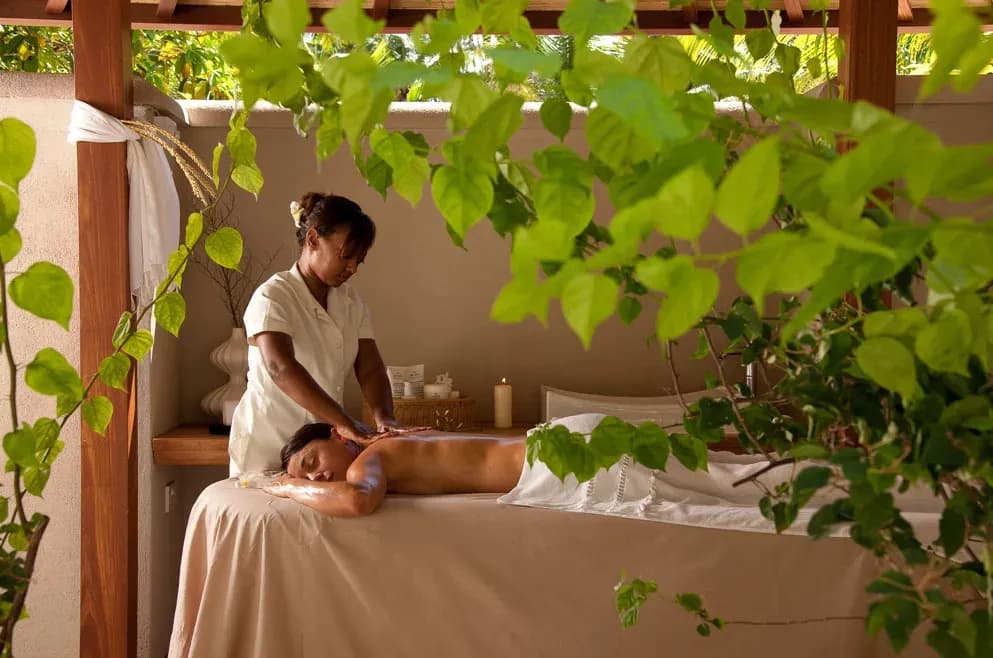 Open-air massage treatment in a garden pavilion at Denis Private Island