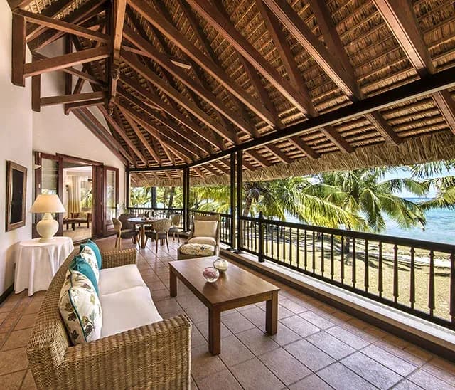 Senior Suite Beachfront living area with garden views at Dinarobin Beachcomber