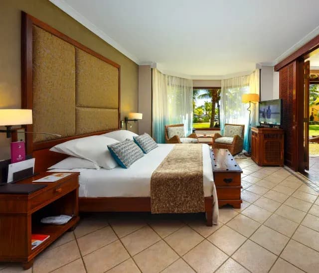 Zen Suite interior in the adults-only area at Dinarobin Beachcomber, with tropical garden views