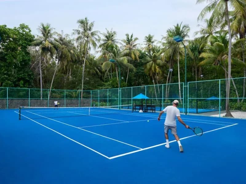 Floodlit tennis court at Dusit Thani Maldives