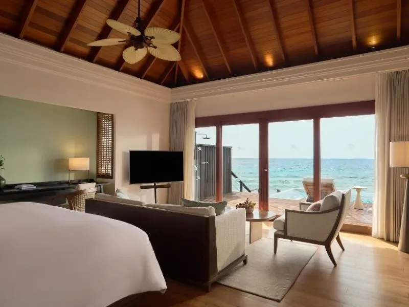 Overwater Pool Villa with glass walls and private pool at Dusit Thani Maldives