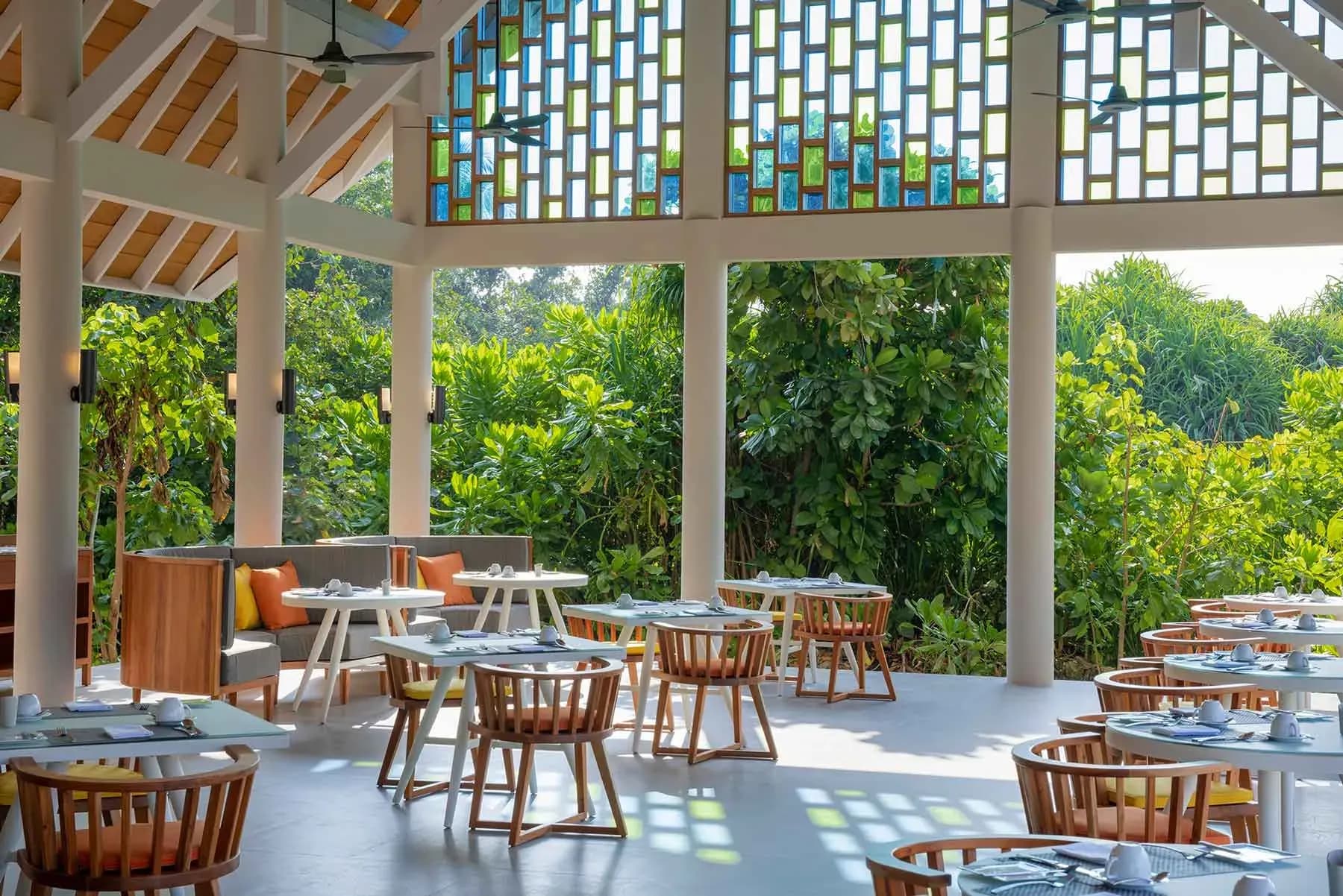 Aqua Restaurant beachfront dining setting at Emerald Faarufushi Resort & Spa