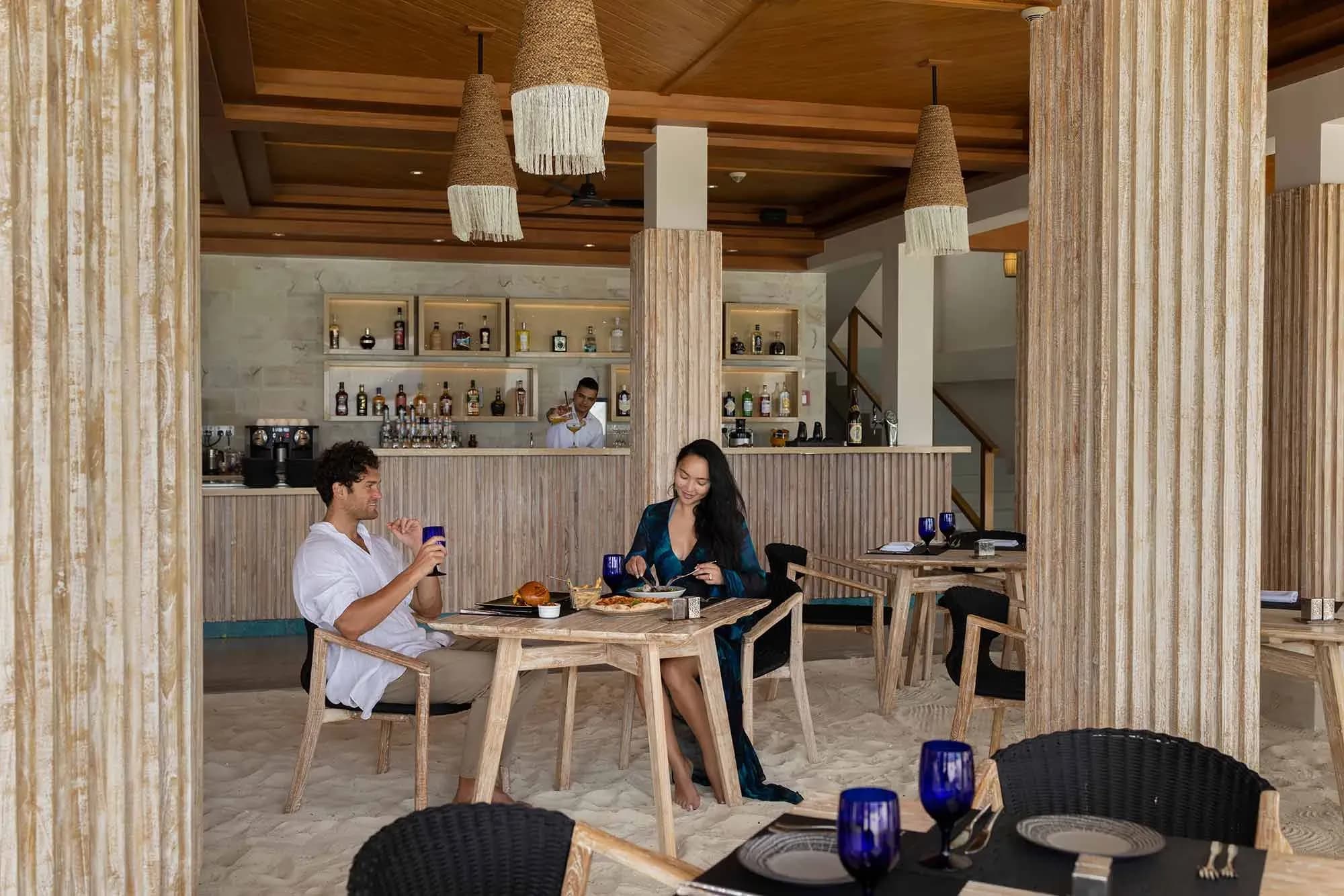 Beach Club Grill Restaurant terrace overlooking the ocean at Emerald Faarufushi Resort & Spa