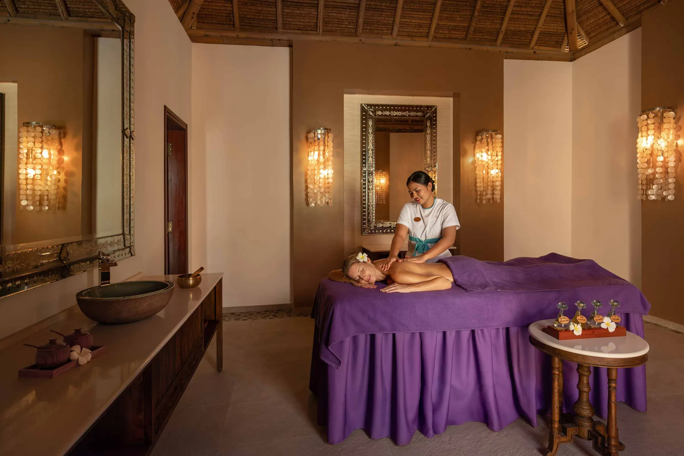 Treatment in progress inside a Balinese-style bungalow at The Emerald Spa
