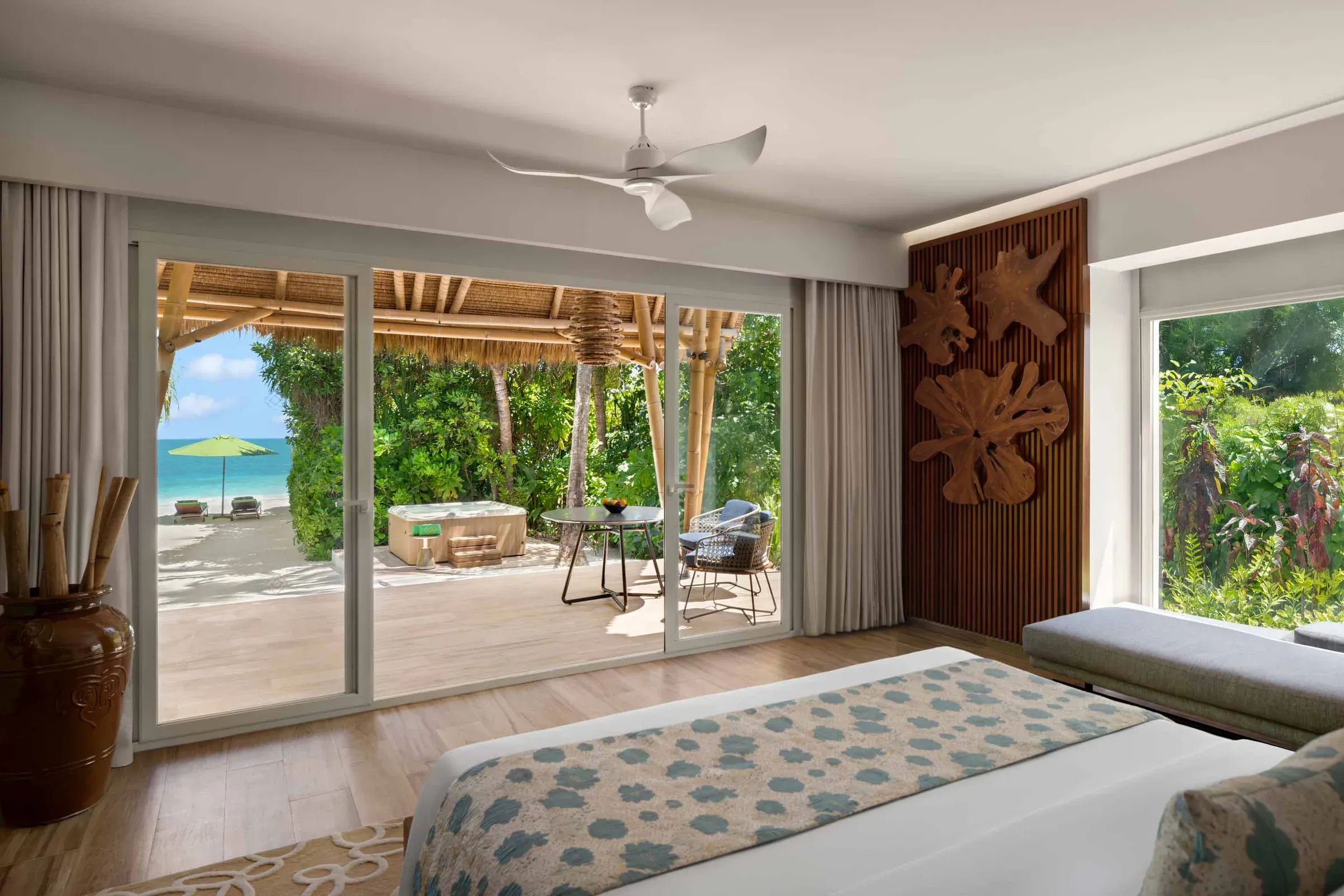 Private jacuzzi and garden at a Jacuzzi Beach Villa, Emerald Maldives Resort & Spa