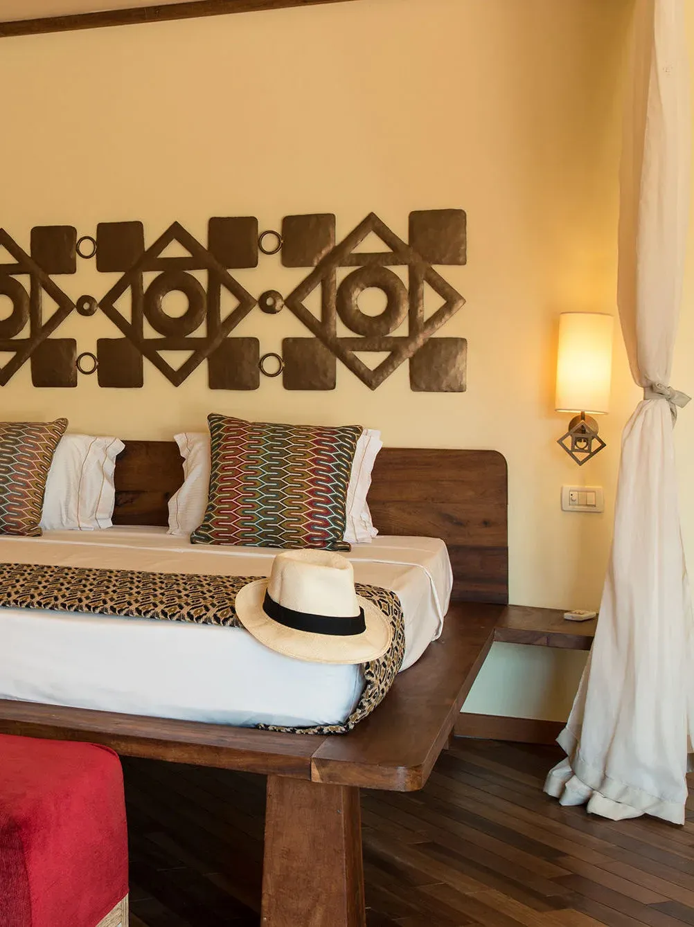 Seafront Villa bedroom detail with African wall art at Essque Zalu Zanzibar