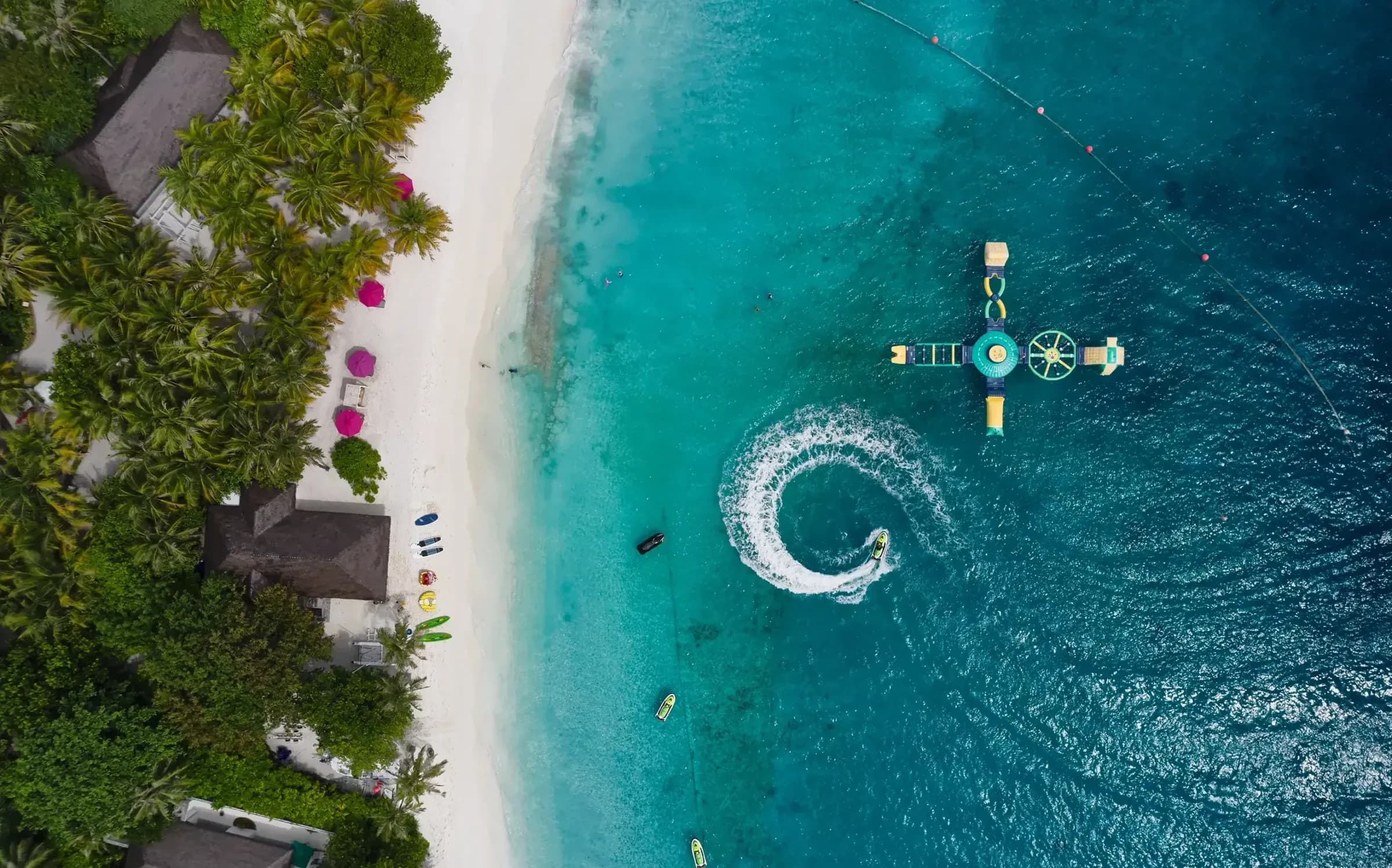 Aerial view of the watersports platform and jet ski at Finolhu Maldives