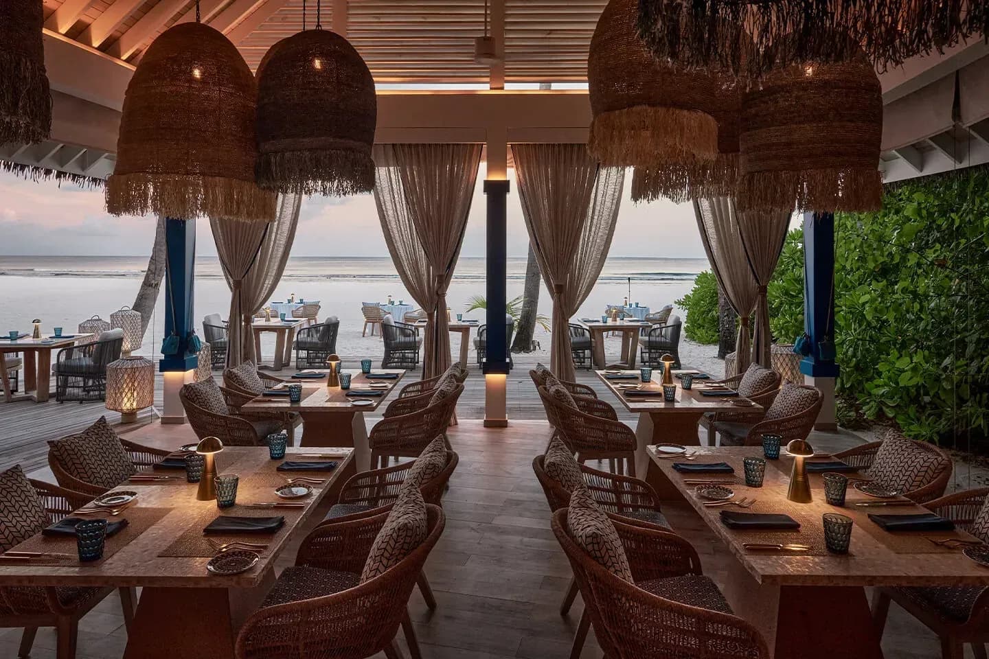 Beachfront dining terrace at Arabian Grill, Finolhu Maldives