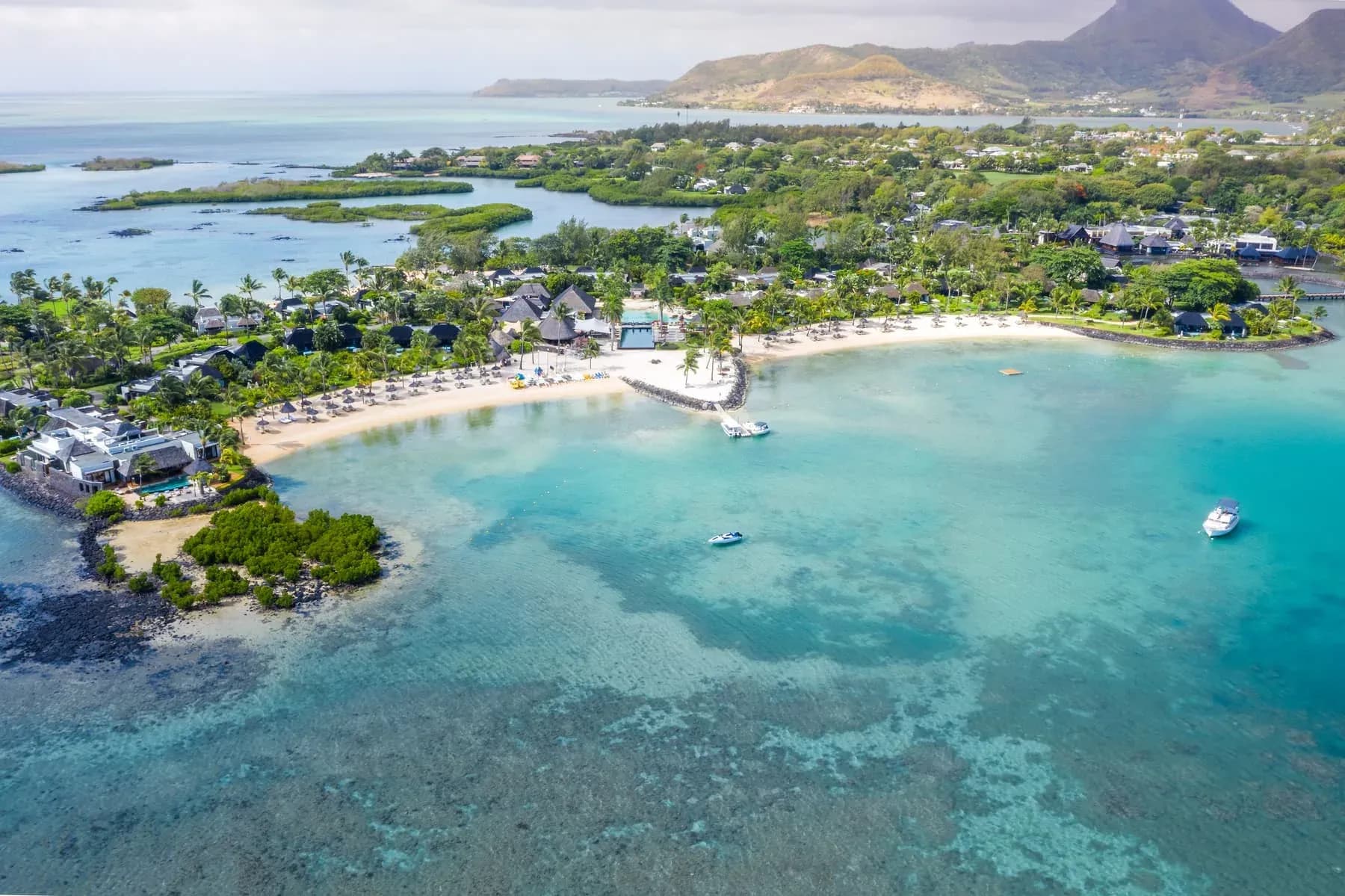 Aerial view of Four Seasons Resort Mauritius at Anahita's beach, lagoon and mangrove peninsula on the east coast