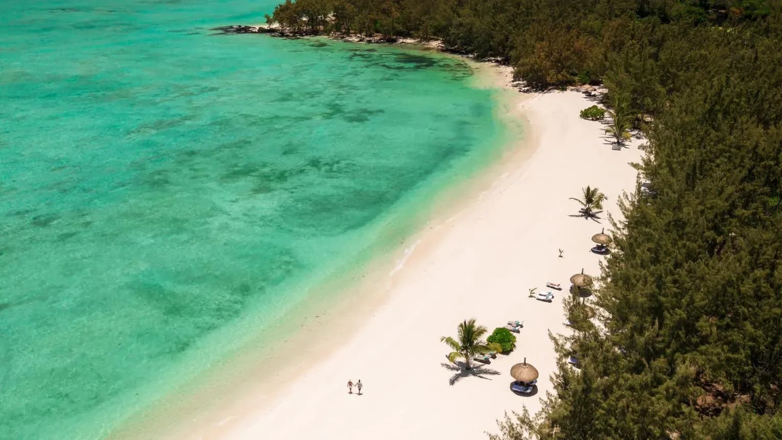 Four Seasons exclusive beach on Île aux Cerfs, reached by boat from the Resort